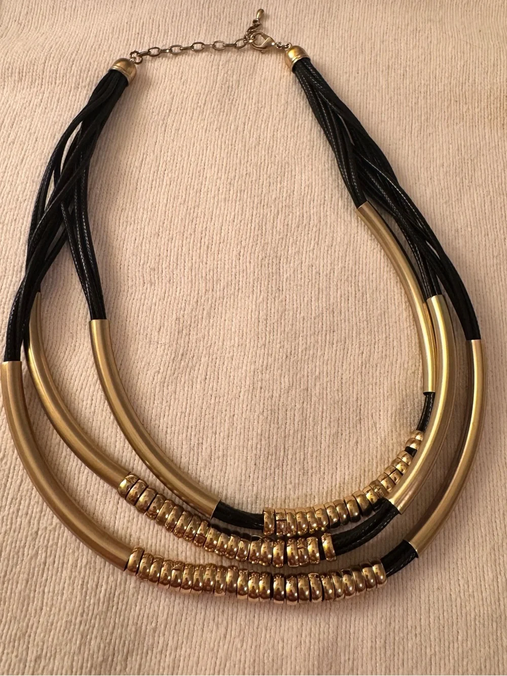 Gorgeous black and gold jewelry lot of 1 necklace and 3 bracelets